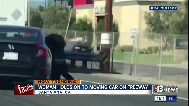Video shows woman clinging to car on California freeway