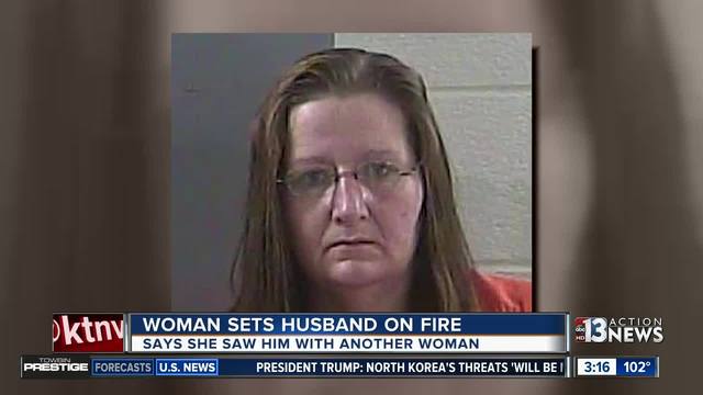 Woman accused of setting her husband on fire